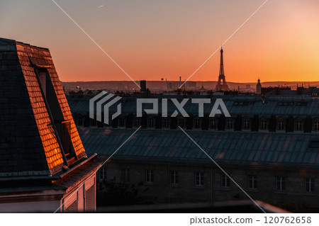 View of Paris and Eiffel Tower and rooftops from above. Beautiful sunset over Paris, France View of Paris and Eiffel Tower and rooftops from above. Beautiful sunset over Paris, France 120762658