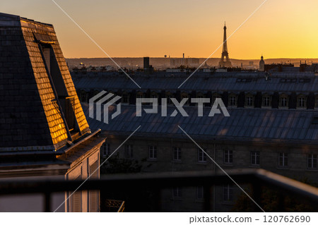 View of Paris and Eiffel Tower and rooftops from above. Beautiful sunset over Paris, France 120762690