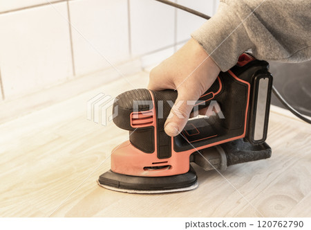 Work with a grinder on wood. Work tool. 120762790