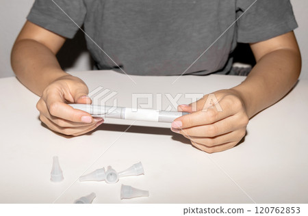 Female hands holding an insulin pen. Ozempic Insulin injection pen. 120762853