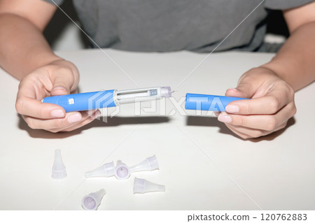 Female hands holding an insulin pen. Ozempic Insulin injection pen. 120762883
