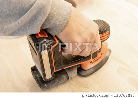 Work with a grinder on wood. Work tool. Work with a grinder on wood. Work tool. 120762885