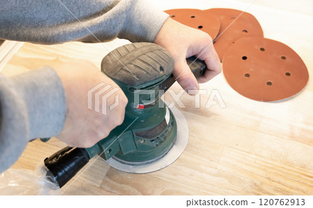 Work with a grinder on wood. Work tool. Work with a grinder on wood. Work tool. 120762913