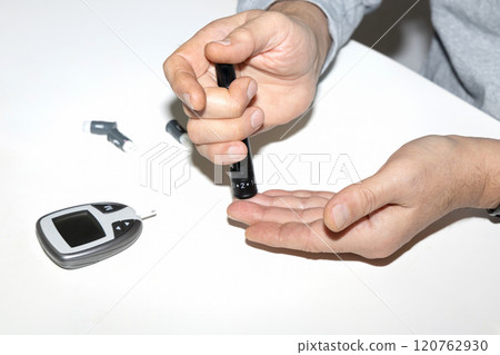 Diabetic man measuring blood sugar level. Blood test for diabetes. Diabetic man measuring blood sugar level. Blood test for diabetes. 120762930