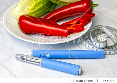 Original Danish Ozempic Insulin injection pen for diabetics and plate with vegetables. Original Danish Ozempic Insulin injection pen for diabetics and plate with vegetables. 120763002
