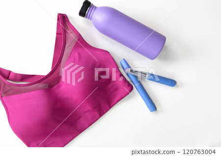 Concept of losing weight with the diabetes drug Ozempic. Sports top and Ozempic syringe pen. 120763004