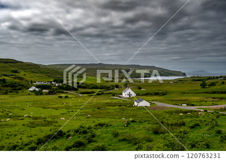Abandoned Road Through Coastal Landscape With Sheep And Cottages At The Atlantic Coast Of The Isle Of Skye In Scotland, UK Abandoned Road Through Coastal Landscape With Sheep And Cottages At The Atlantic Coast Of The Isle Of Skye In Scotland, UK 120763231