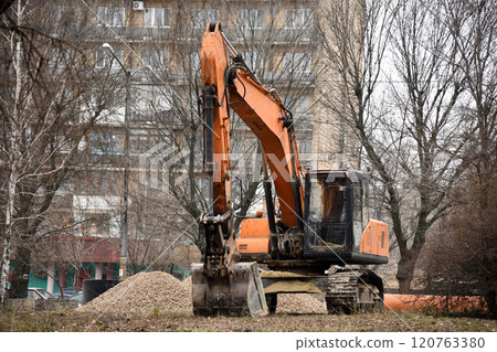 Excavator on earthworks. Excavator on construction site on sunset. Open-pit mining. Backhoe dig ground in quarry. Heavy construction equipment on excavation on construction site. Groundwork Excavator on earthworks. Excavator on construction site on sunset. Open-pit mining. Backhoe dig ground in quarry. Heavy construction equipment on excavation on construction site. Groundwork 120763380