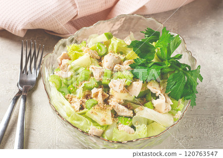 Waldorf salad, celery salad with apple, in a glass salad bowl, natural light, homemade, no people, 120763547
