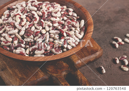 variegated beans, red with white spots, raw in a wooden bowl, top view, no people, variegated beans, red with white spots, raw in a wooden bowl, top view, no people, 120763548