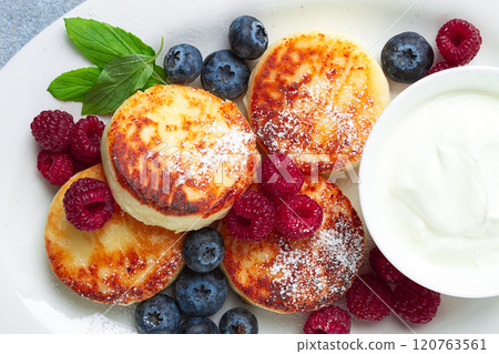 breakfast, cottage cheese cakes, with fresh berries, and sour cream, top view, close-up, no people, breakfast, cottage cheese cakes, with fresh berries, and sour cream, top view, close-up, no people, 120763561
