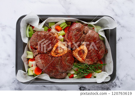 fried meat on the bone, raw, chopped vegetables, ingredients in the oven, for cooking ossobuco, top view, no people, 120763619