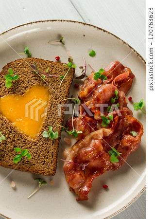 Breakfast, fried egg with bacon, micro-green, on a light background, no people, selective focus, Breakfast, fried egg with bacon, micro-green, on a light background, no people, selective focus, 120763623