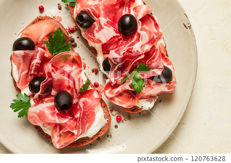 sandwich with cream cheese, prosciutto with olives , breakfast, 120763628