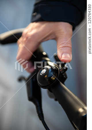 handlebar with bell and grip of a e-bike handlebar with bell and grip of a e-bike 120764380