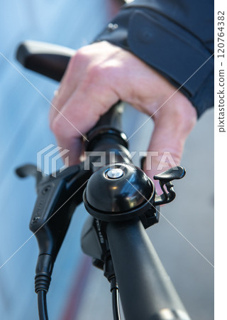 handlebar with bell and grip of a e-bike handlebar with bell and grip of a e-bike 120764382