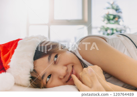 Happy woman wake up in Christmas morning expecting for a happy new year party. 120764489
