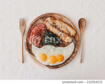 Protein keto diet breakfast meal of fish ham spinach and eggs. 120764515
