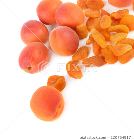 Ripe juicy apricots and dried apricots isolated on white background. 120764917