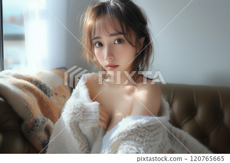 A natural woman relaxing on a sofa 120765665