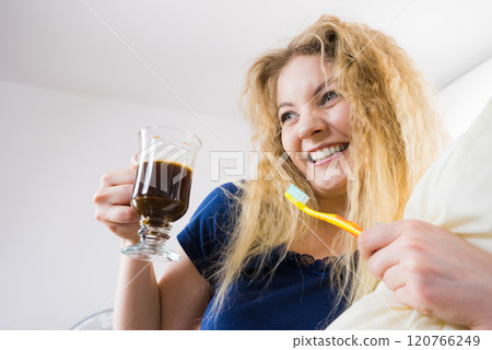 Funny woman being late drinking coffee 120766249