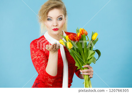 Pretty woman with red yellow tulips bunch 120766305