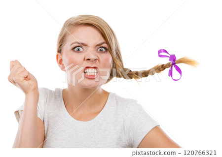 Teenage girl in braid hair making angry face 120766321