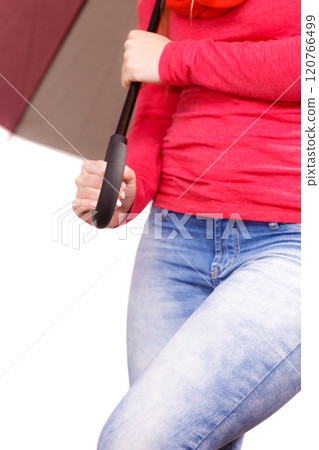 Woman standing under multicolored umbrella 120766499