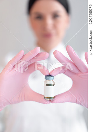 Anonymous female dermatologist holding medicine 120768076