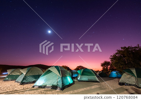 Full moon over a campsite Full moon over a campsite 120768084