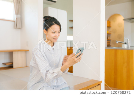 A woman relaxing sitting on a tatami mat 120768271