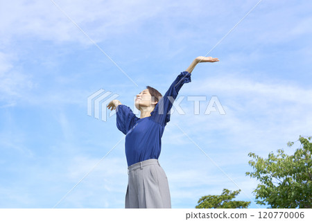 A woman taking a deep breath outside A woman taking a deep breath outside 120770006