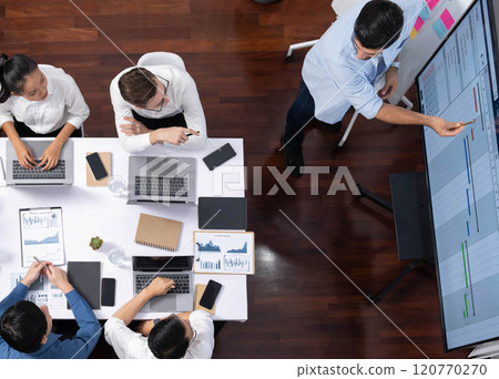 Analyst team utilizing BI Fintech to analyze financial data at table. Prudent Analyst team utilizing BI Fintech to analyze financial data at table. Prudent 120770270