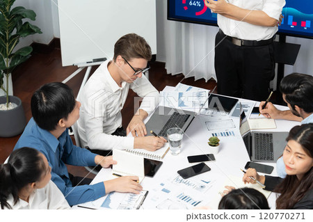 Analyst team utilizing BI Fintech to analyze financial data at table. Prudent Analyst team utilizing BI Fintech to analyze financial data at table. Prudent 120770271