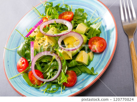 Appetizing salad with avocado, arugula 120770824