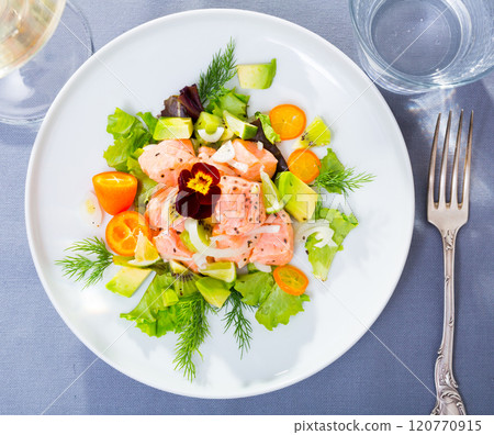 Tasty seafood ceviche from salmon with avocado, green dill and cumquat 120770915