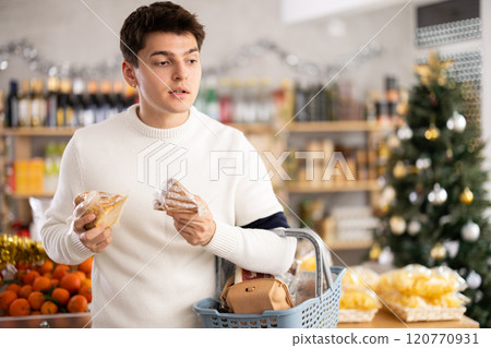 Man chooses cheese 120770931