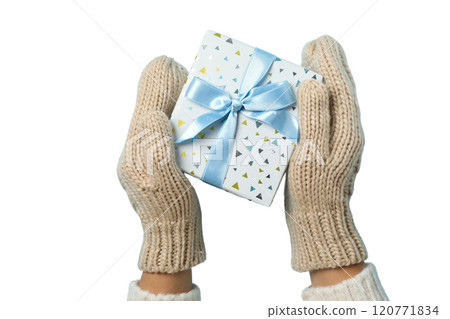 Happy New Year, gift box in hands with mittens, created with Generative AI technology, PNG 120771834