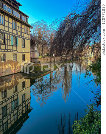 Historic buildings in Petite France district of Strasbourg, France. Old houses on the banks of the river Rhine in Strasbourg, France.  120771859