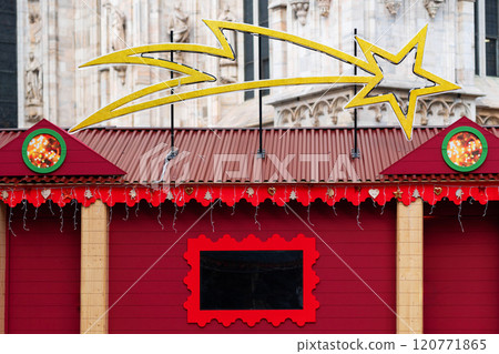 Christmas Star Decoration Above Holiday Market Stalls 120771865