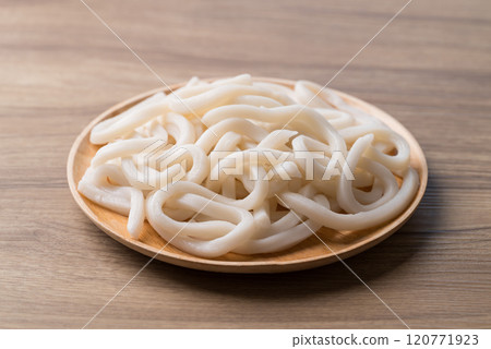 Udon noodles on wooden plate, Thick noodles in Japanese cuisine 120771923