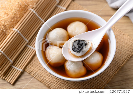 Tangyuan (Chinese sweet dumpling), Glutinous rice flour filling with black sesame in ginger syrup Tangyuan (Chinese sweet dumpling), Glutinous rice flour filling with black sesame in ginger syrup 120771937