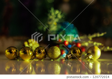 Christmas background with fir twigs, red berries, cones and Xmas lights Christmas background with fir twigs, red berries, cones and Xmas lights 120772014