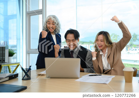 Group of business professionals celebrating their successful project in the office 120772266