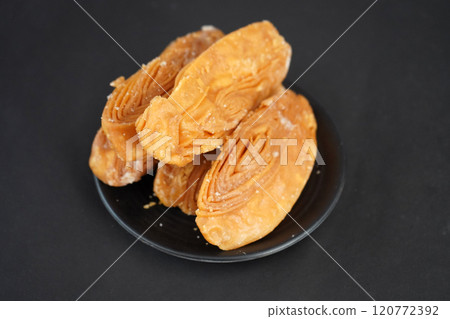 Crunchy khaja in black plate 120772392