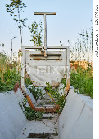 Irrigation ditch, drained aryk in city park Irrigation ditch, drained aryk in city park 120774016