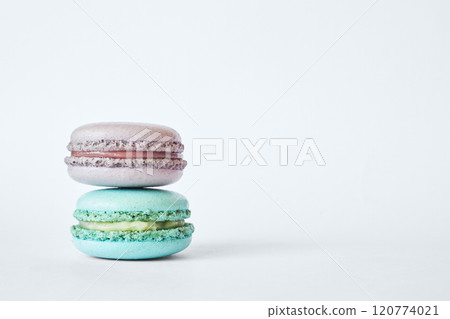 Stack of two colorful French Macarons, macaroons cakes with different flavors Stack of two colorful French Macarons, macaroons cakes with different flavors 120774021