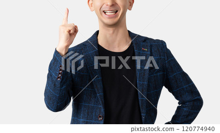 A smiling male businessman pointing with his index finger up 120774940
