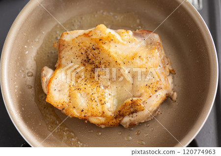 Cook chicken thigh steaks in a frying pan Cook chicken thigh steaks in a frying pan 120774963