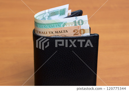 Maltese lira in the black wallet 120775344